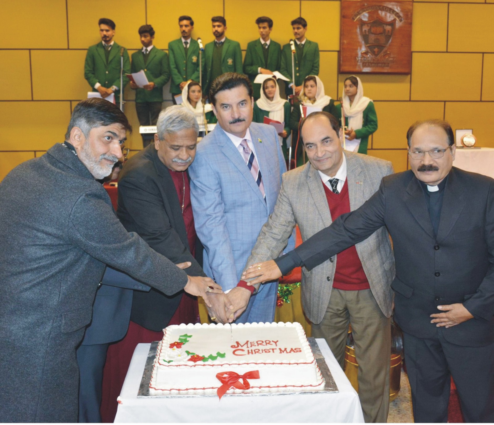 Governor Khyber Pakhtunkhwa Faisal Karim Kundi cutting Christmas Cake during a function at Edwardes College, Peshawar.