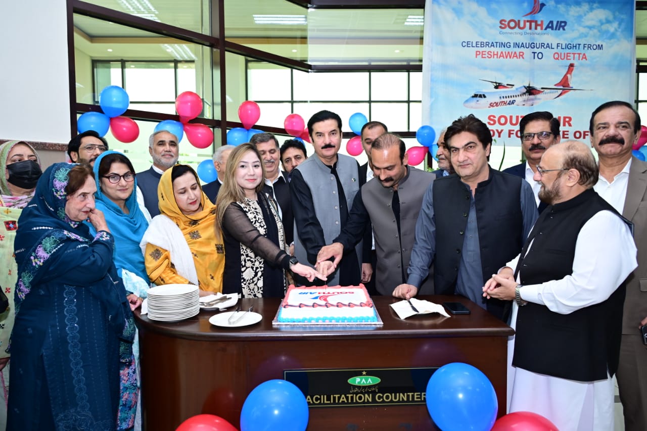 Kundi cuts the cake during the inaugural ceremony marking the launch of South Air’s flight service from Peshawar to Quetta at Bacha Khan International Airport, Peshawar.